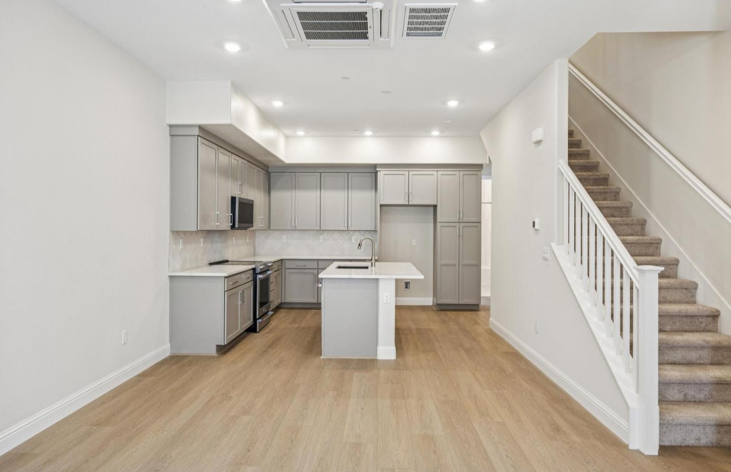 2417 Willow Way San Mateo, CA 94403 - Photo 9 of 34 a view of a kitchen with a sink and dishwasher a refrigerator with wooden floor