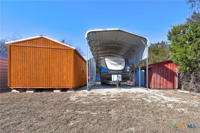 a view of a room with wooden walls