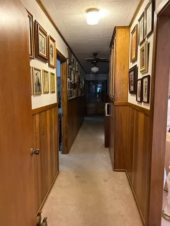 a view of a entryway door with hallway