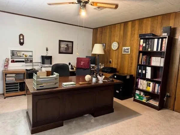 a room with furniture window and book shelf