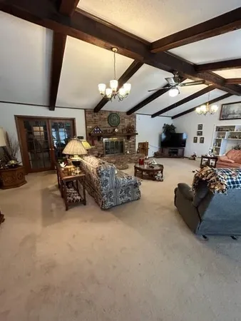 a living room with furniture and a mirror