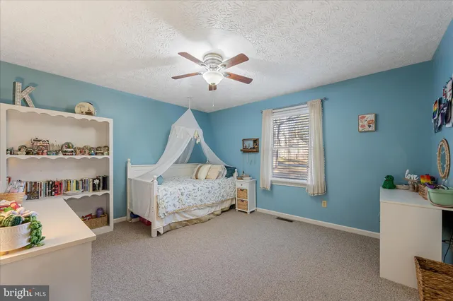 a bathroom with a sink toilet and mirror