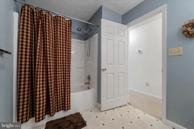 a living room with furniture cabinets and book shelf