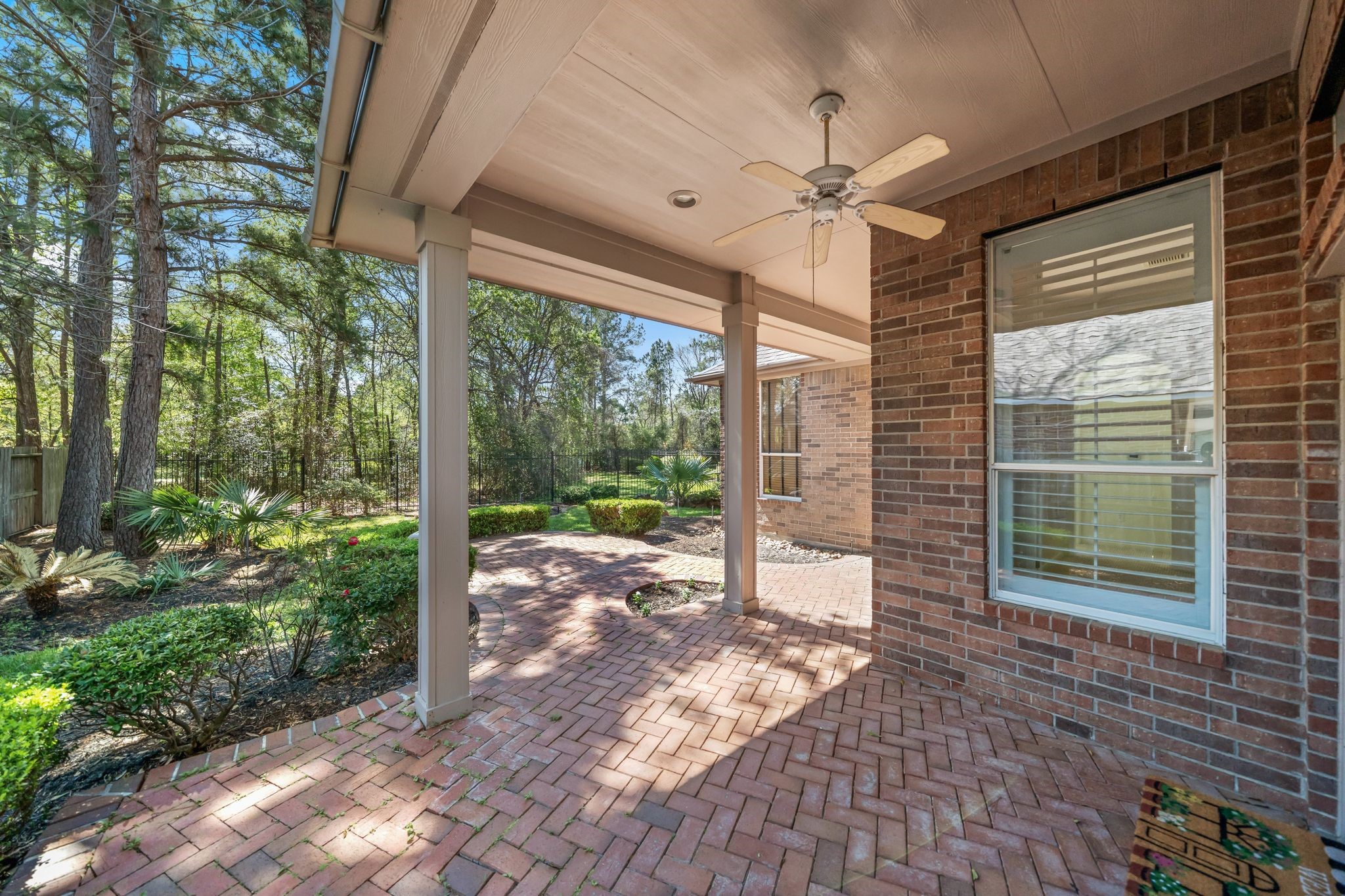 7 Sovereign Way Conroe, TX 77384 - Photo 20 of 31 a view of a porch with a table and chairs