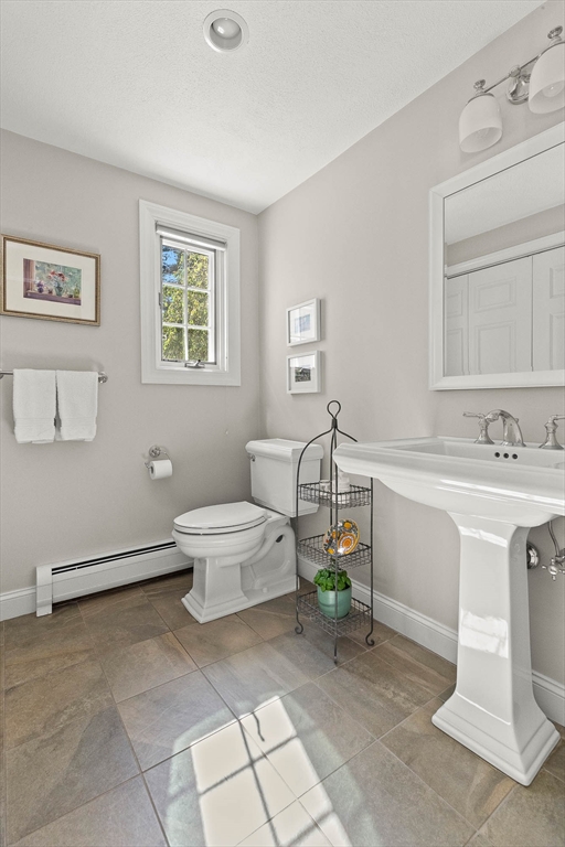 6 Arrowhead Farm Road Boxford, MA 01921 - Photo 25 of 42 a spacious bathroom with a toilet sink and mirror