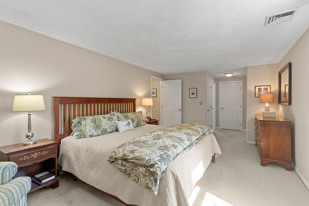6 Arrowhead Farm Road Boxford, MA 01921 - Photo 28 of 42 a spacious bedroom with a bed and a couch