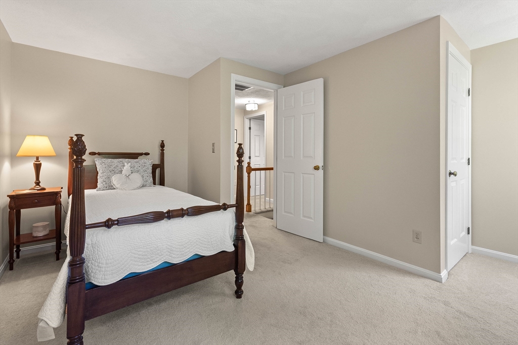 6 Arrowhead Farm Road Boxford, MA 01921 - Photo 31 of 42 a bedroom with a bed and a table