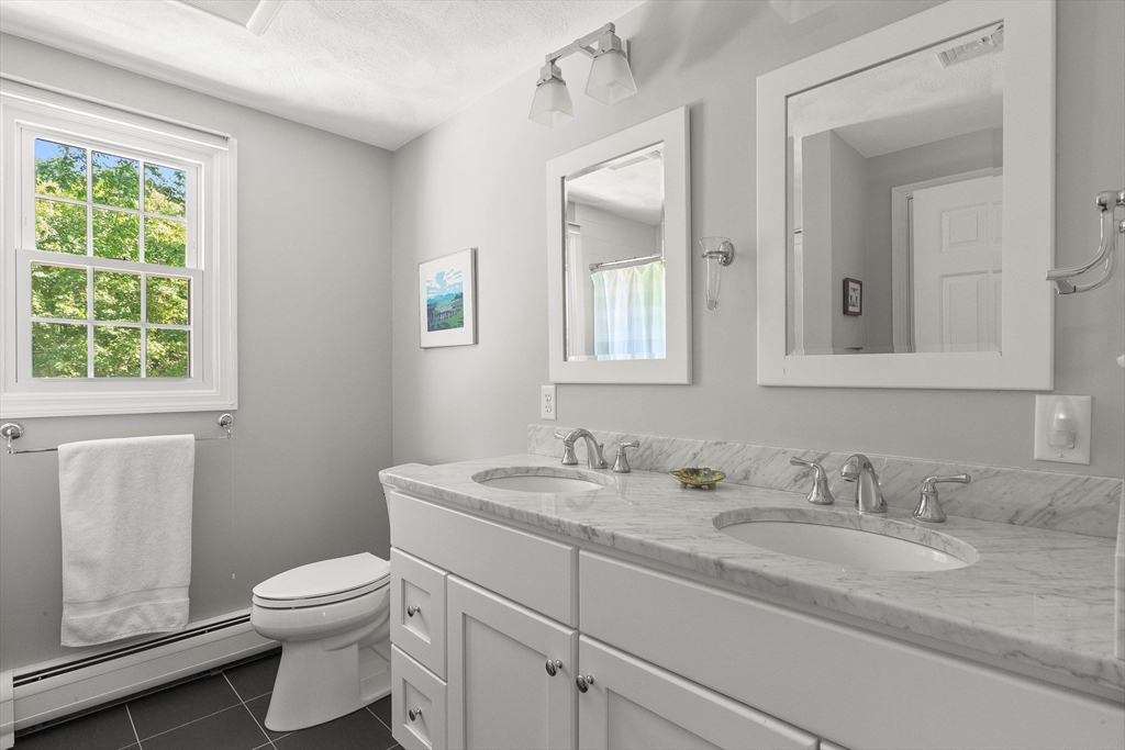 6 Arrowhead Farm Road Boxford, MA 01921 - Photo 35 of 42 a bathroom with a granite countertop toilet sink and mirror