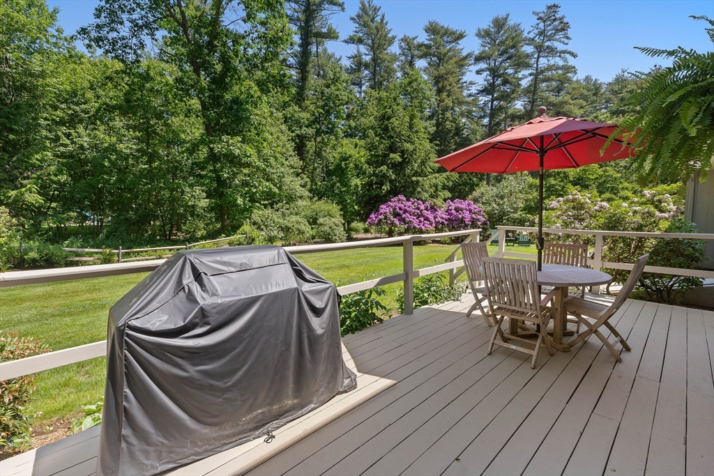 6 Arrowhead Farm Road Boxford, MA 01921 - Photo 6 of 42 an outdoor sitting area with furniture and umbrella