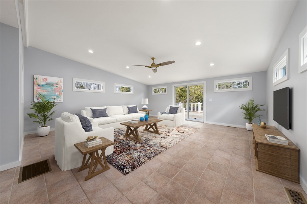 5 Lanes End Natick, MA 01760 - Photo 11 of 27 a living room with furniture and a flat screen tv