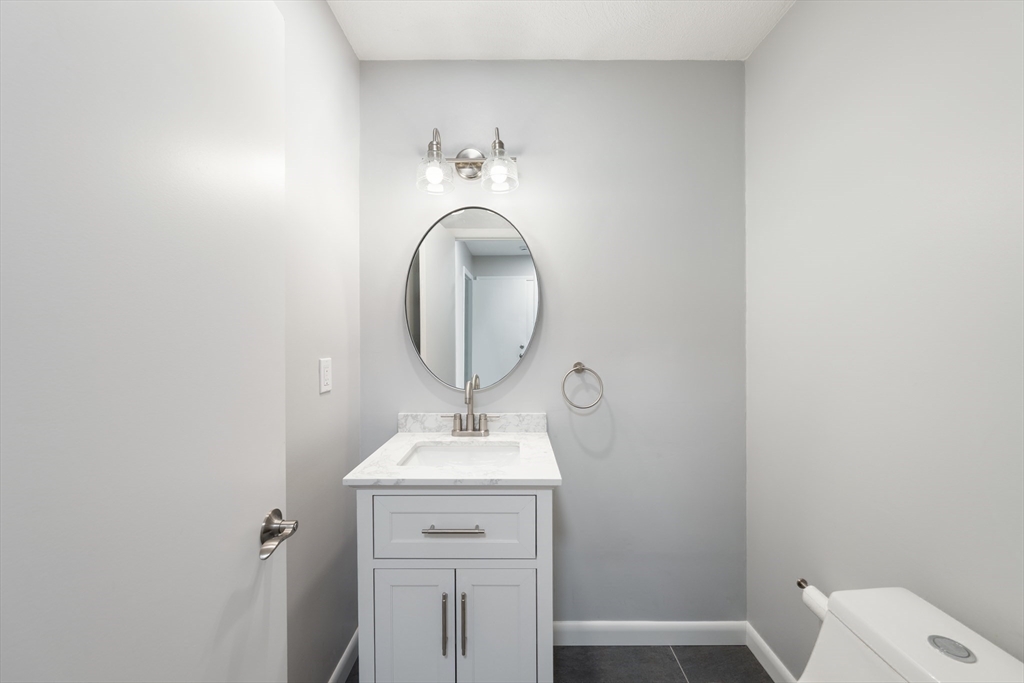 5 Lanes End Natick, MA 01760 - Photo 12 of 27 a bathroom with a sink and a mirror