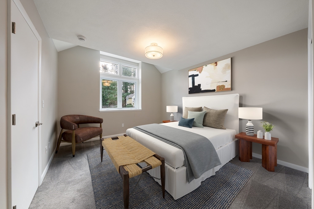 5 Lanes End Natick, MA 01760 - Photo 13 of 27 a bedroom with a bed and a chair