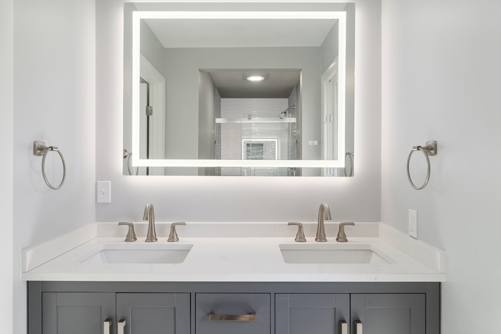 5 Lanes End Natick, MA 01760 - Photo 14 of 27 a bathroom with a sink and a mirror