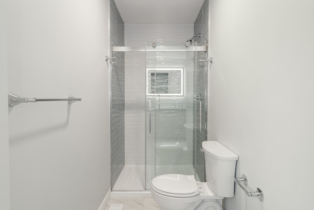 5 Lanes End Natick, MA 01760 - Photo 15 of 27 a bathroom with a granite countertop shower toilet and sink