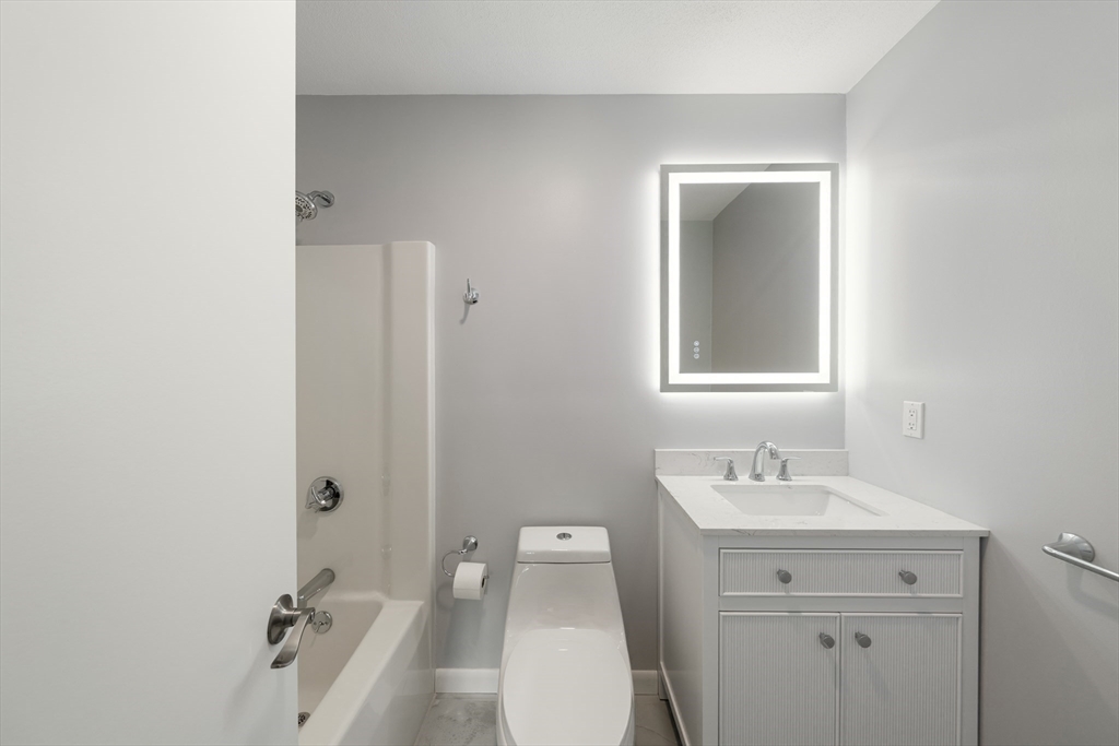 5 Lanes End Natick, MA 01760 - Photo 18 of 27 a bathroom with a sink a toilet and shower