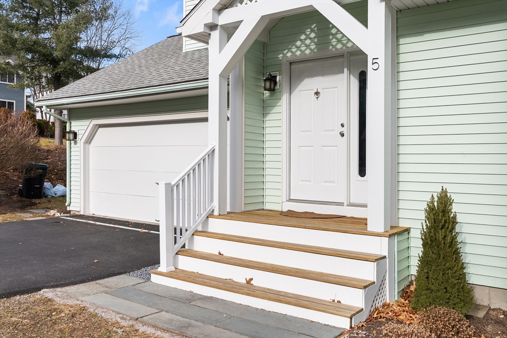 5 Lanes End Natick, MA 01760 - Photo 2 of 27 a front view of a house with a window and stairs