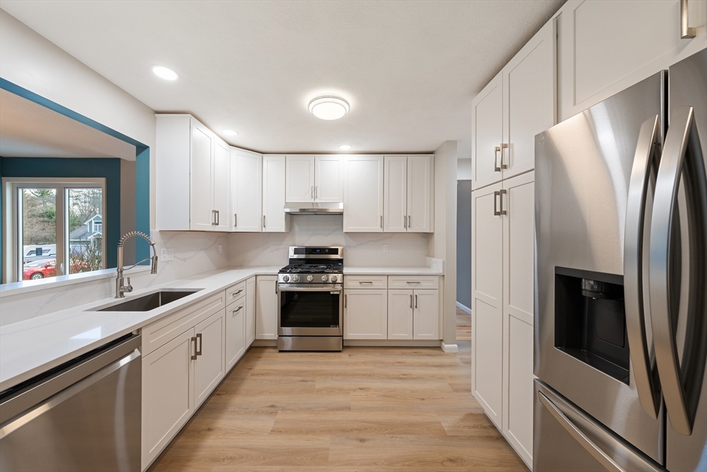 5 Lanes End Natick, MA 01760 - Photo 3 of 27 a kitchen with stainless steel appliances a refrigerator sink and stove