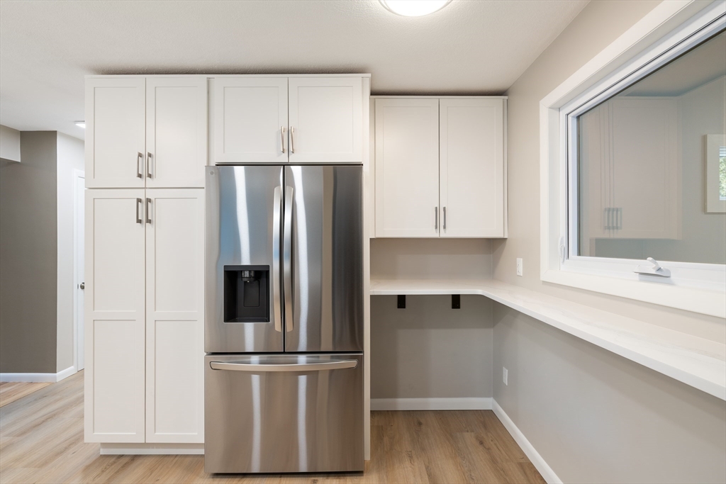 5 Lanes End Natick, MA 01760 - Photo 4 of 27 a kitchen with stainless steel appliances a refrigerator sink and cabinets