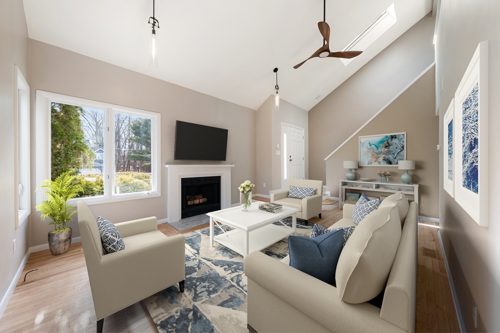5 Lanes End Natick, MA 01760 - Photo 6 of 27 a living room with furniture fireplace and a flat screen tv
