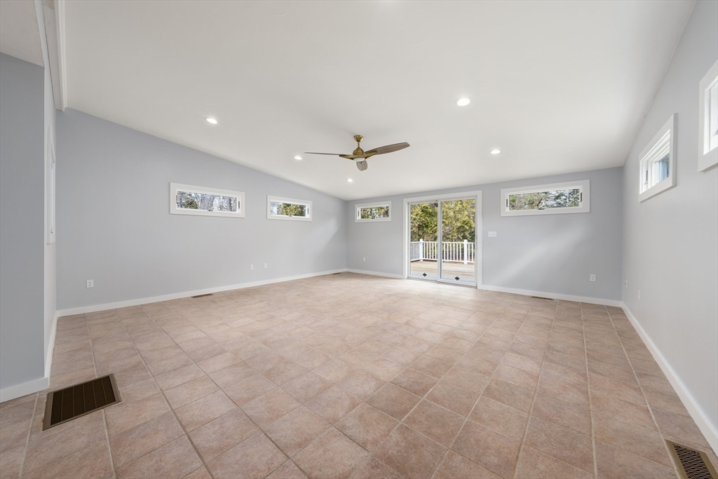 5 Lanes End Natick, MA 01760 - Photo 10 of 27 a view of a livingroom with a ceiling fan and window