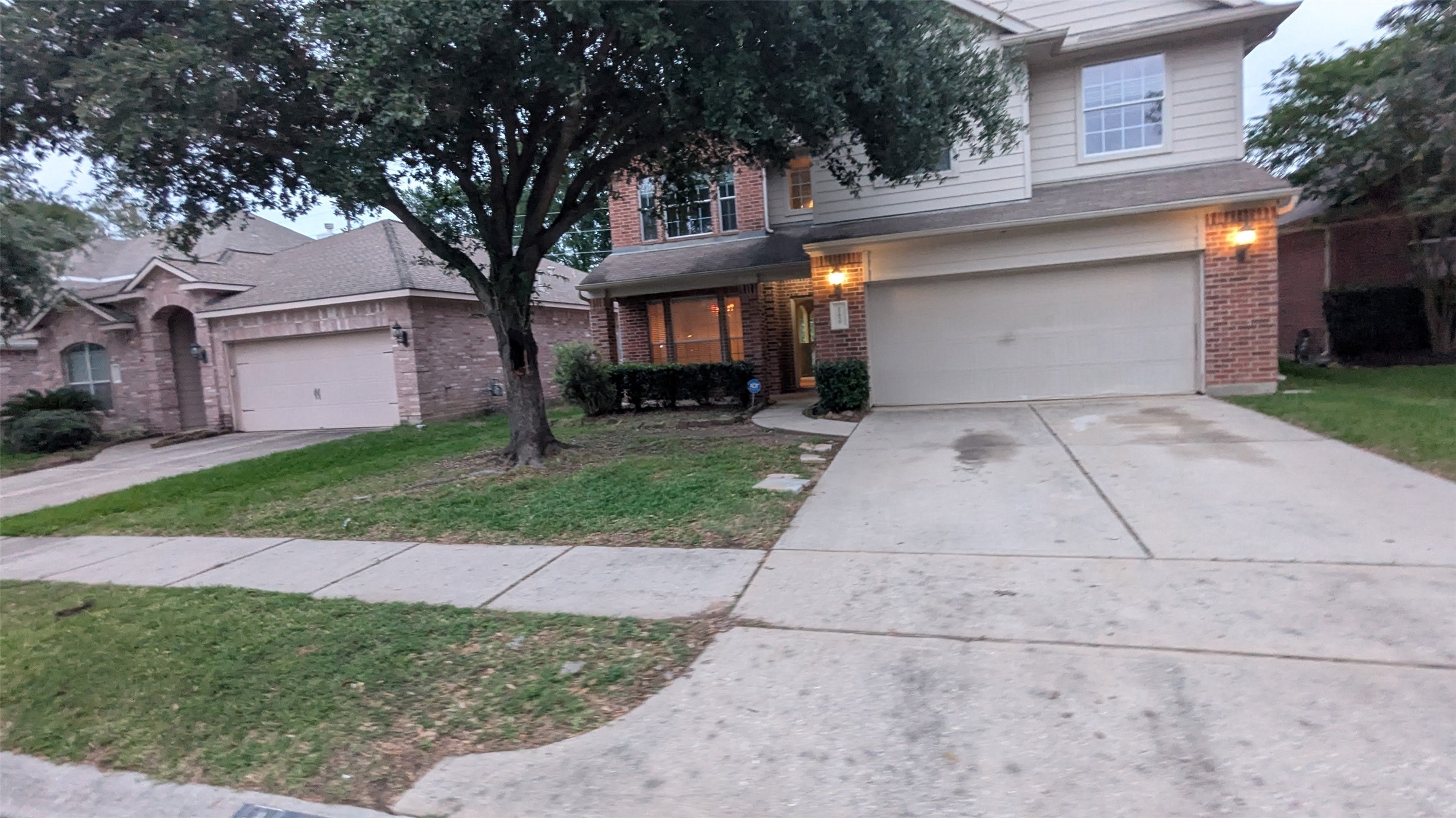 21850 Catoosa Drive Spring, TX 77388 - Photo 1 of 15 front view of a house with a yard