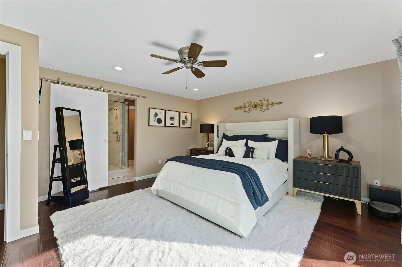 839 Country Club Road Walla Walla, WA 99362 - Photo 16 of 40 a bedroom with a large bed and a chandelier