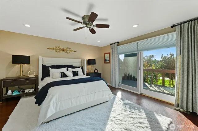 a bedroom with a large bed and a window