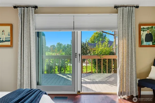 a view of a room that has a bed in it