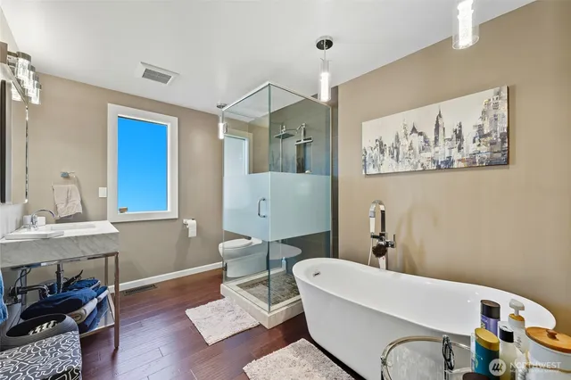 a bathroom with a bathtub and a sink