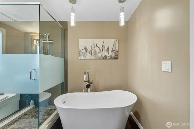 a bathroom with a sink and mirror with toilet