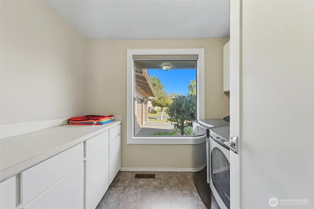 a bathroom with a bathtub sink and mirror