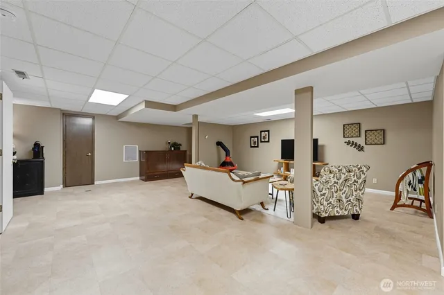 a living room with furniture and white furniture