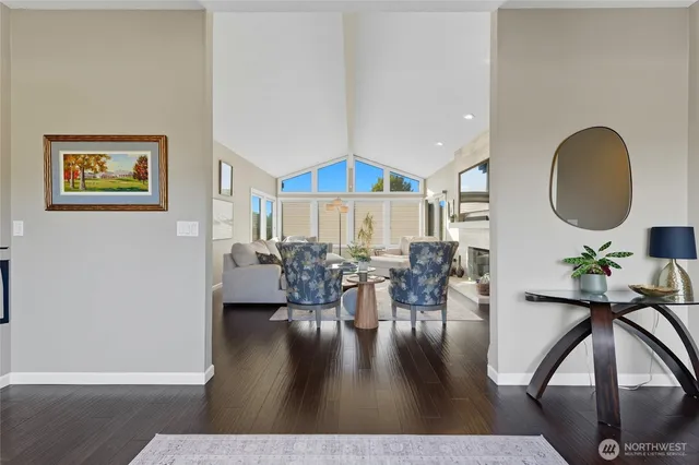 a view of a livingroom with furniture and wooden floor