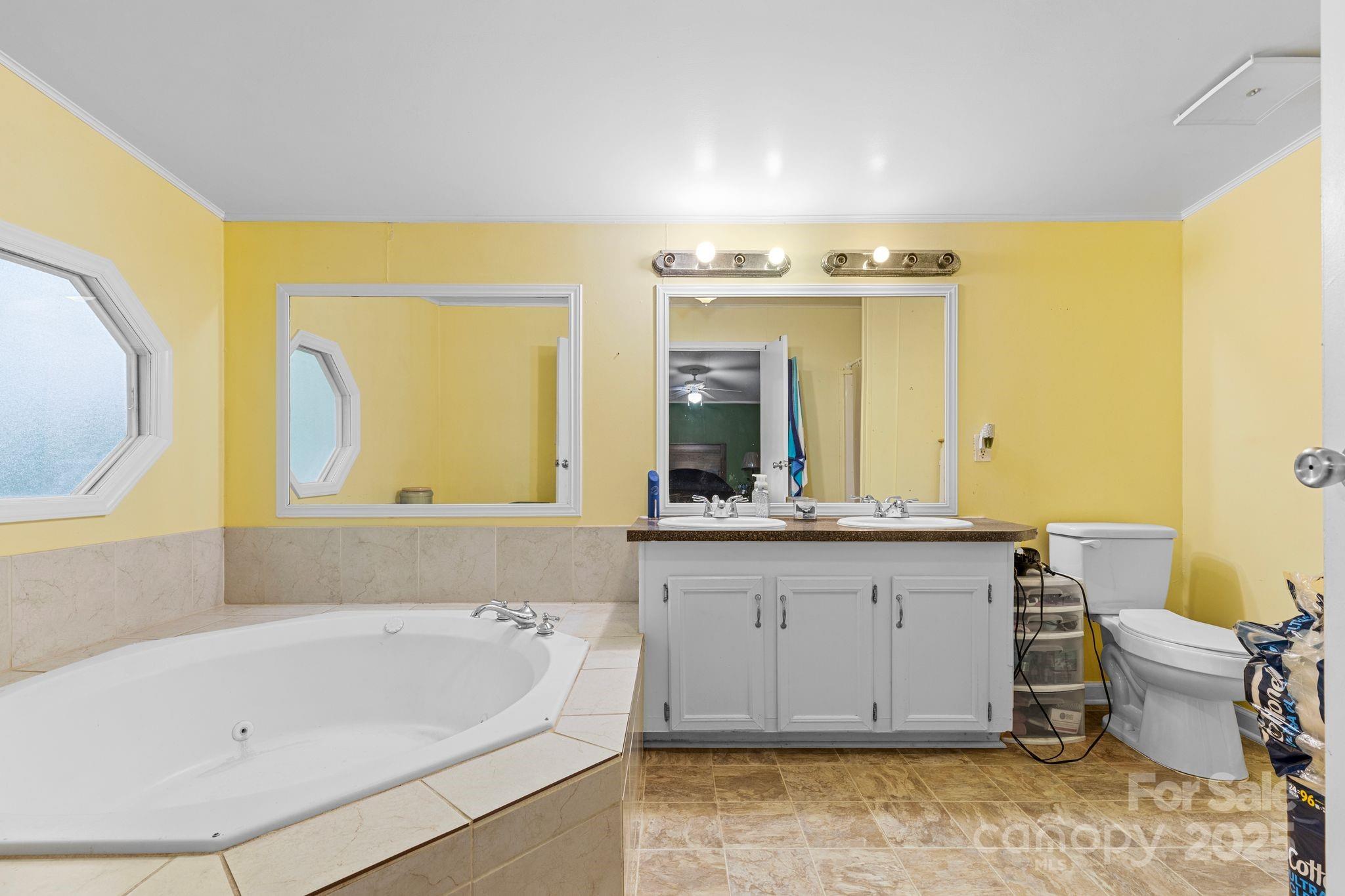 1902 Rock Hollar Road Stanley, NC 28164 - Photo 12 of 27 a bathroom with a bathtub sink and toilet