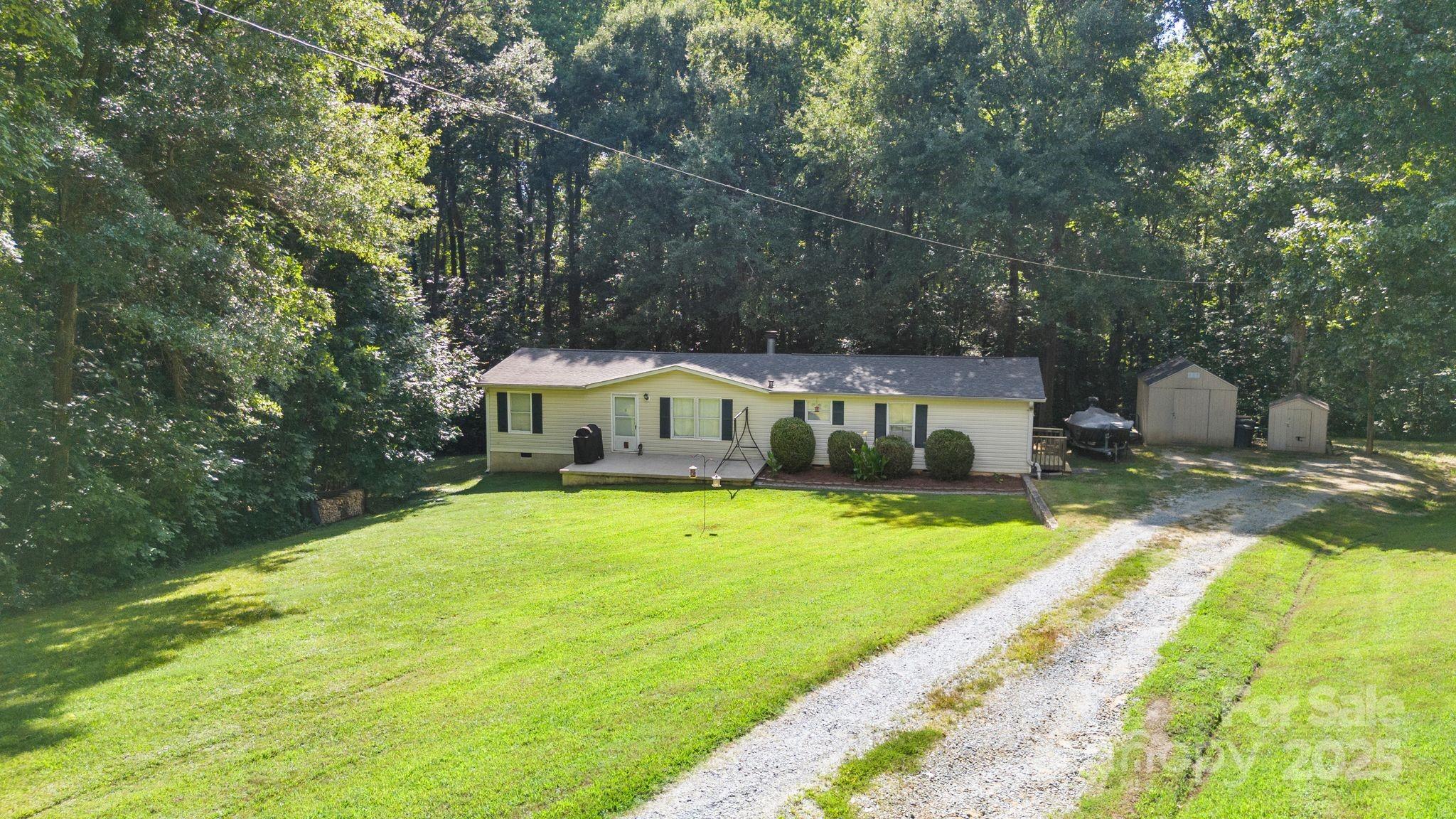 1902 Rock Hollar Road Stanley, NC 28164 - Photo 2 of 27 a view of a house with a yard