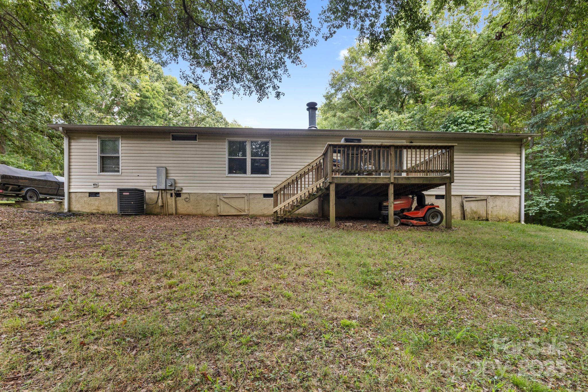 1902 Rock Hollar Road Stanley, NC 28164 - Photo 21 of 27 a view of a house with a yard and sitting area