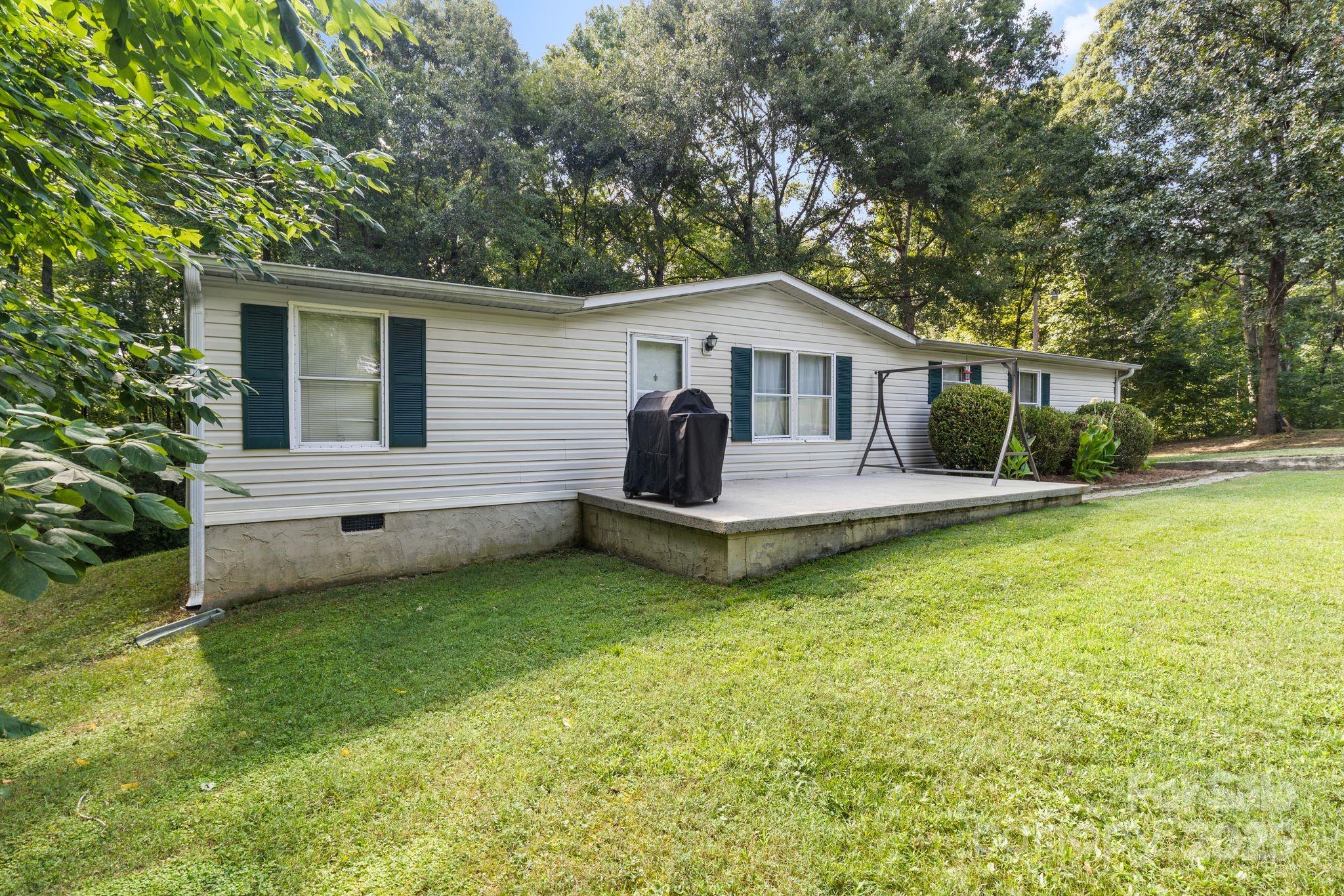 1902 Rock Hollar Road Stanley, NC 28164 - Photo 26 of 27 a view of a house with a yard and sitting area