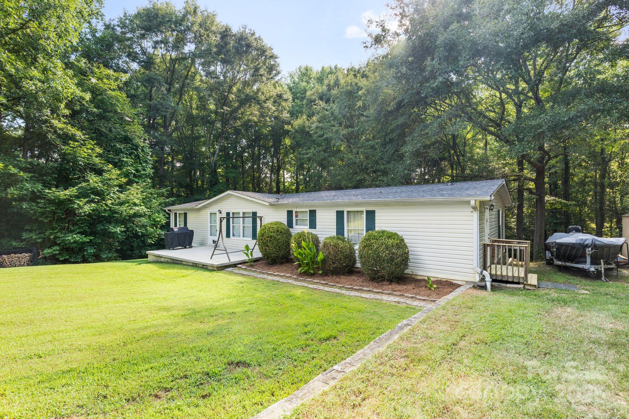 1902 Rock Hollar Road Stanley, NC 28164 - Photo 27 of 27 a view of a house with a yard and sitting area