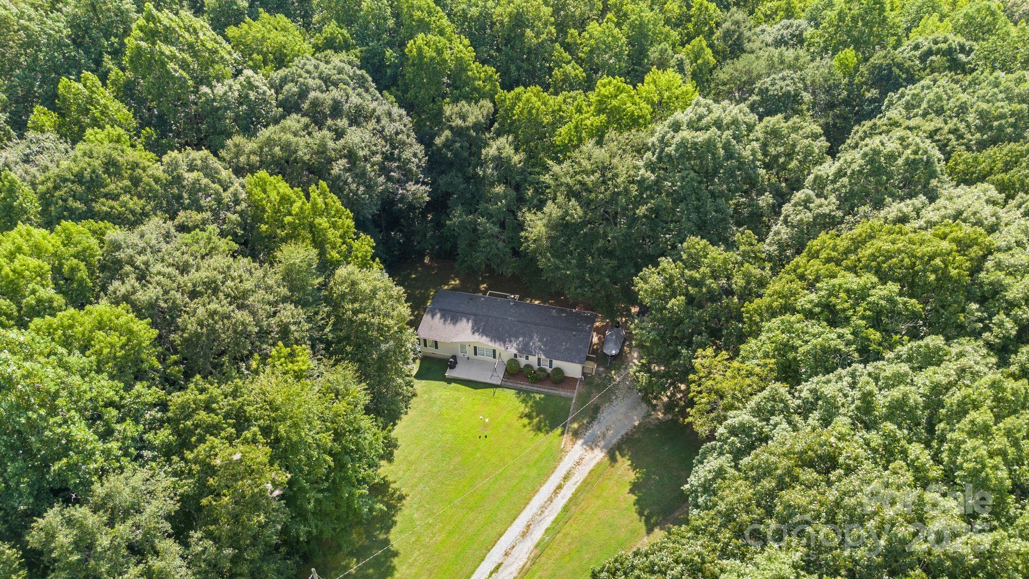 1902 Rock Hollar Road Stanley, NC 28164 - Photo 4 of 27 an aerial view of a residential houses with yard