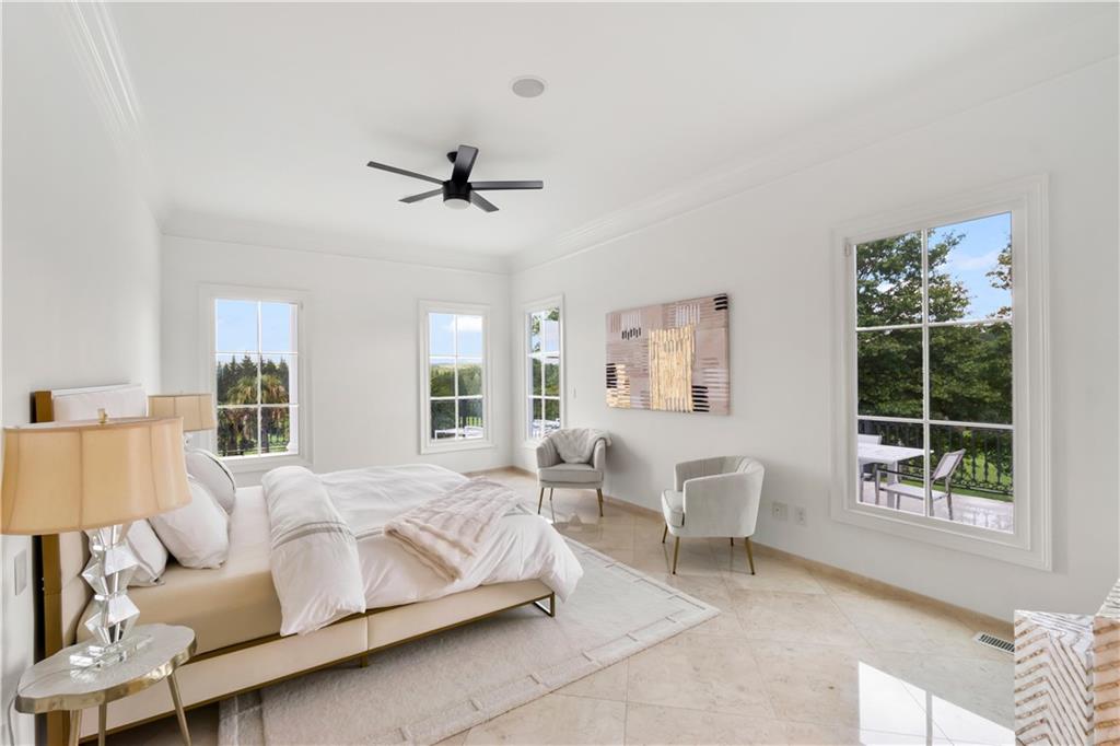 1775 Double Springs Church Road Monroe, GA 30656 - Photo 26 of 91 a spacious bedroom with a bed and a window