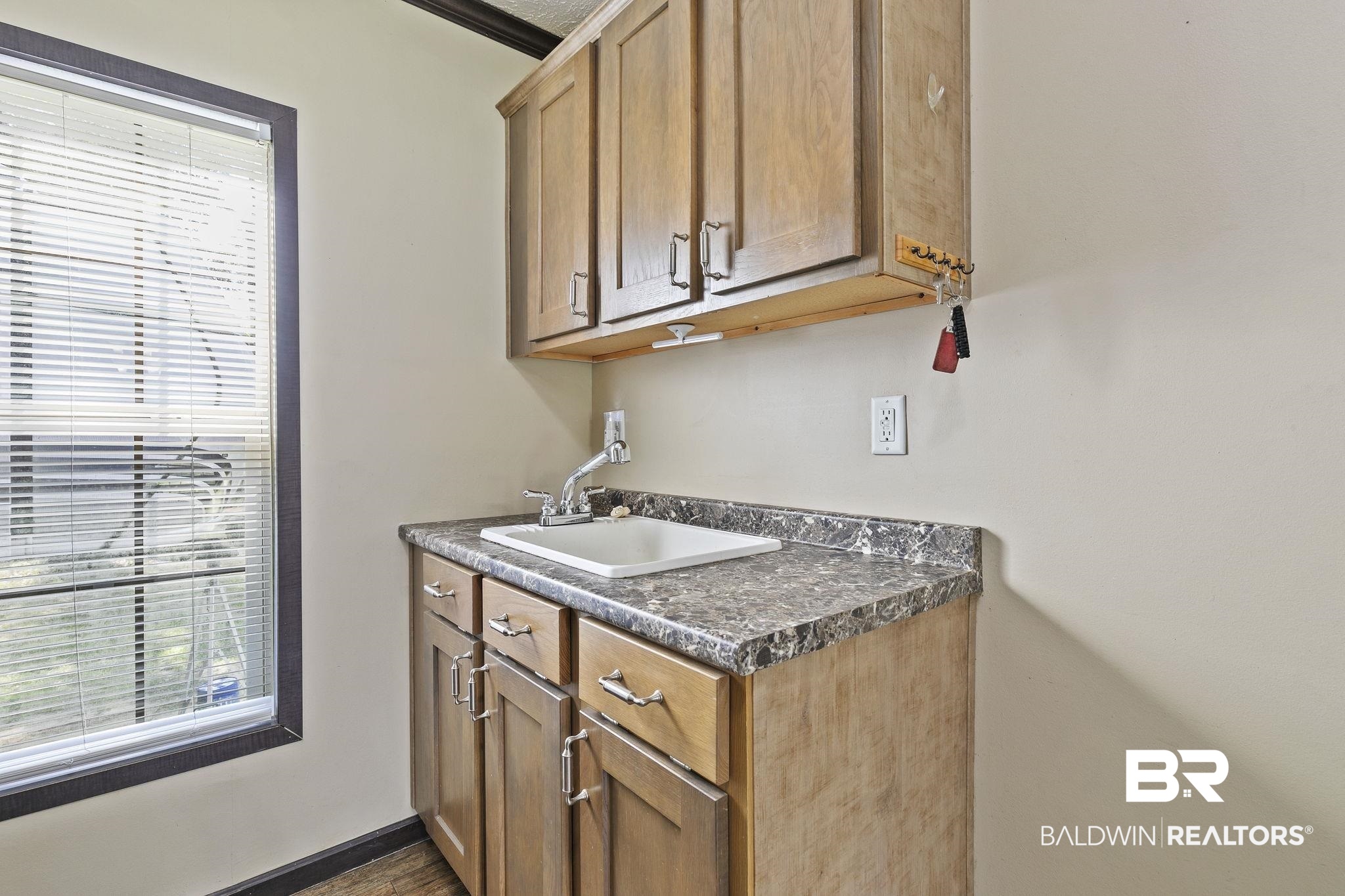 35641 County Road 39 Stapleton, AL 36578 - Photo 21 of 46 Kitchen with crown molding, sink, dark wood-type flooring, and a wealth of natural light