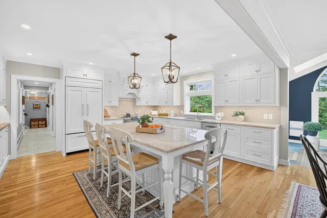 a stove top oven sitting inside of a kitchen