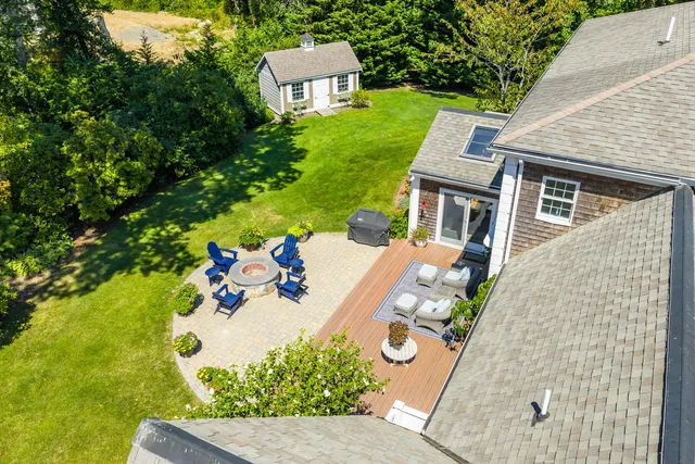 an aerial view of a house with yard