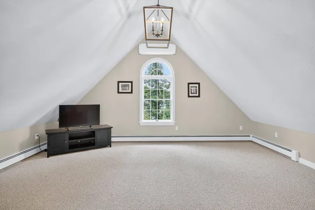 a view of a house with a yard and sitting area