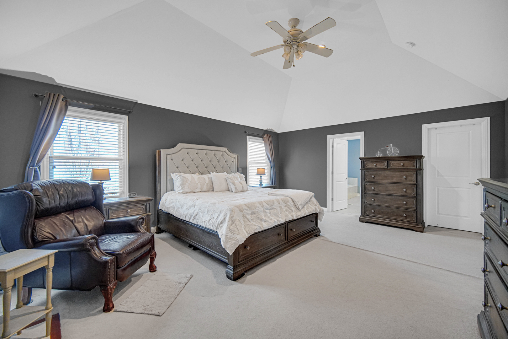 25216 Round Barn Road Plainfield, IL 60585 - Photo 17 of 31 a bedroom with a bed a dresser and a window