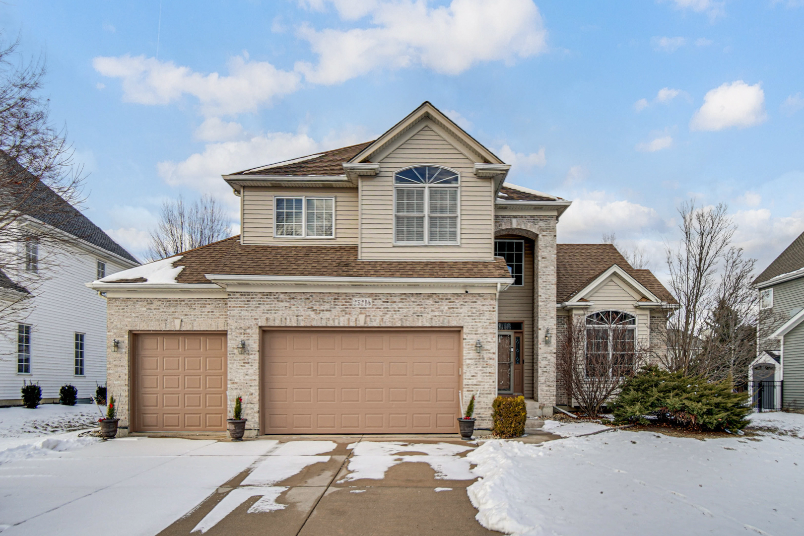 25216 Round Barn Road Plainfield, IL 60585 - Photo 2 of 31 a front view of a house with a yard