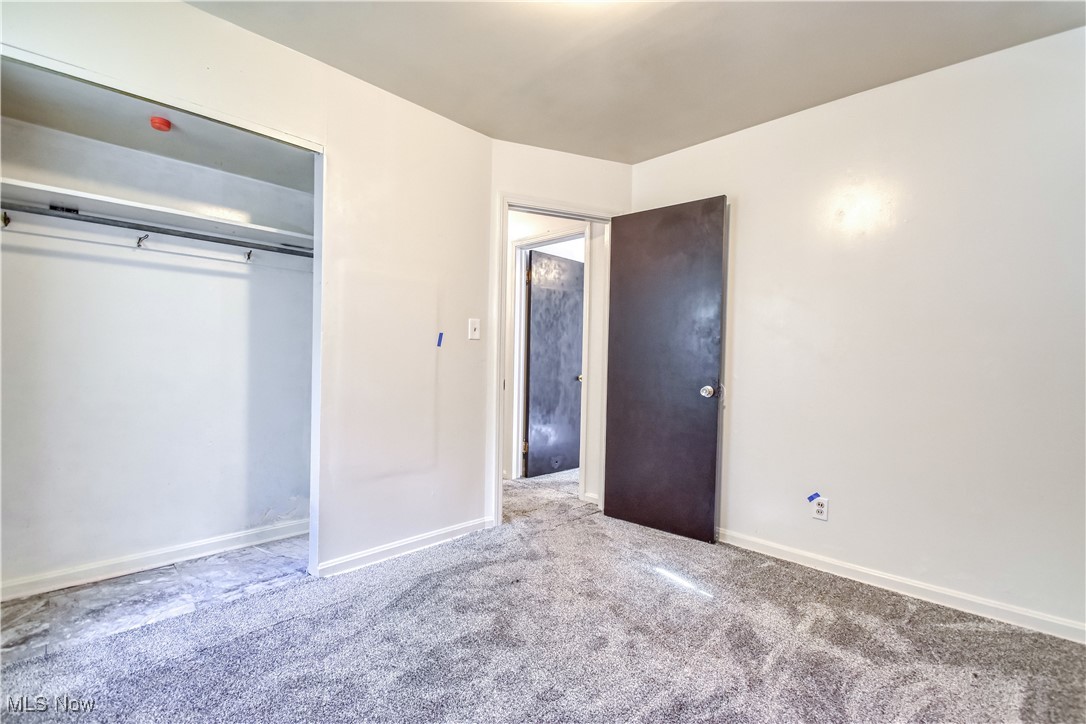 4380 Wyatt Road Cleveland, OH 44128 - Photo 7 of 26 Unfurnished bedroom featuring carpet floors and a closet