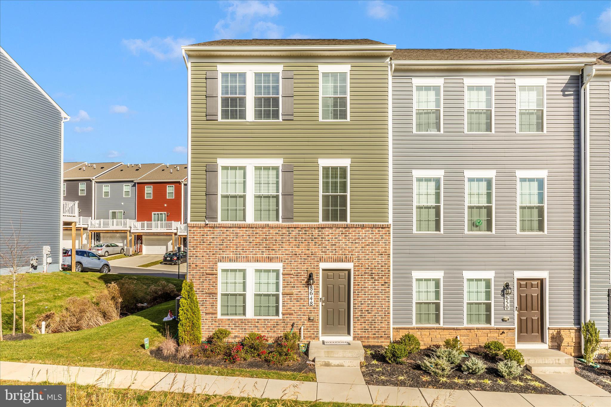 a front view of a house with many windows