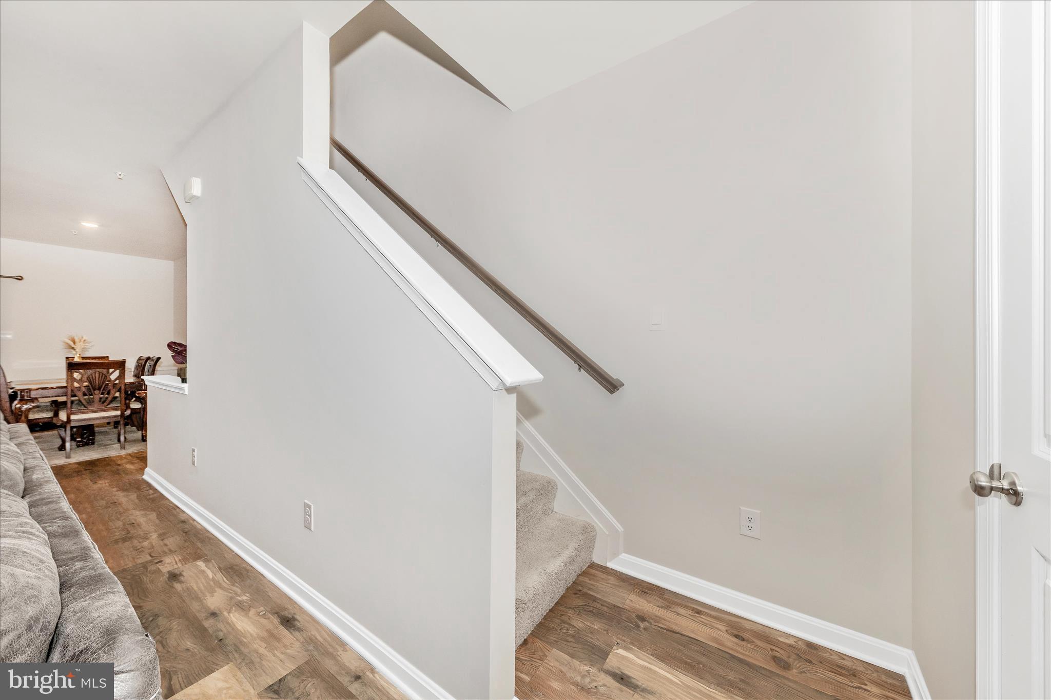 8648 Walter Martz Road Frederick, MD 21702 - Photo 22 of 50 a view of a hallway with wooden floor and staircase