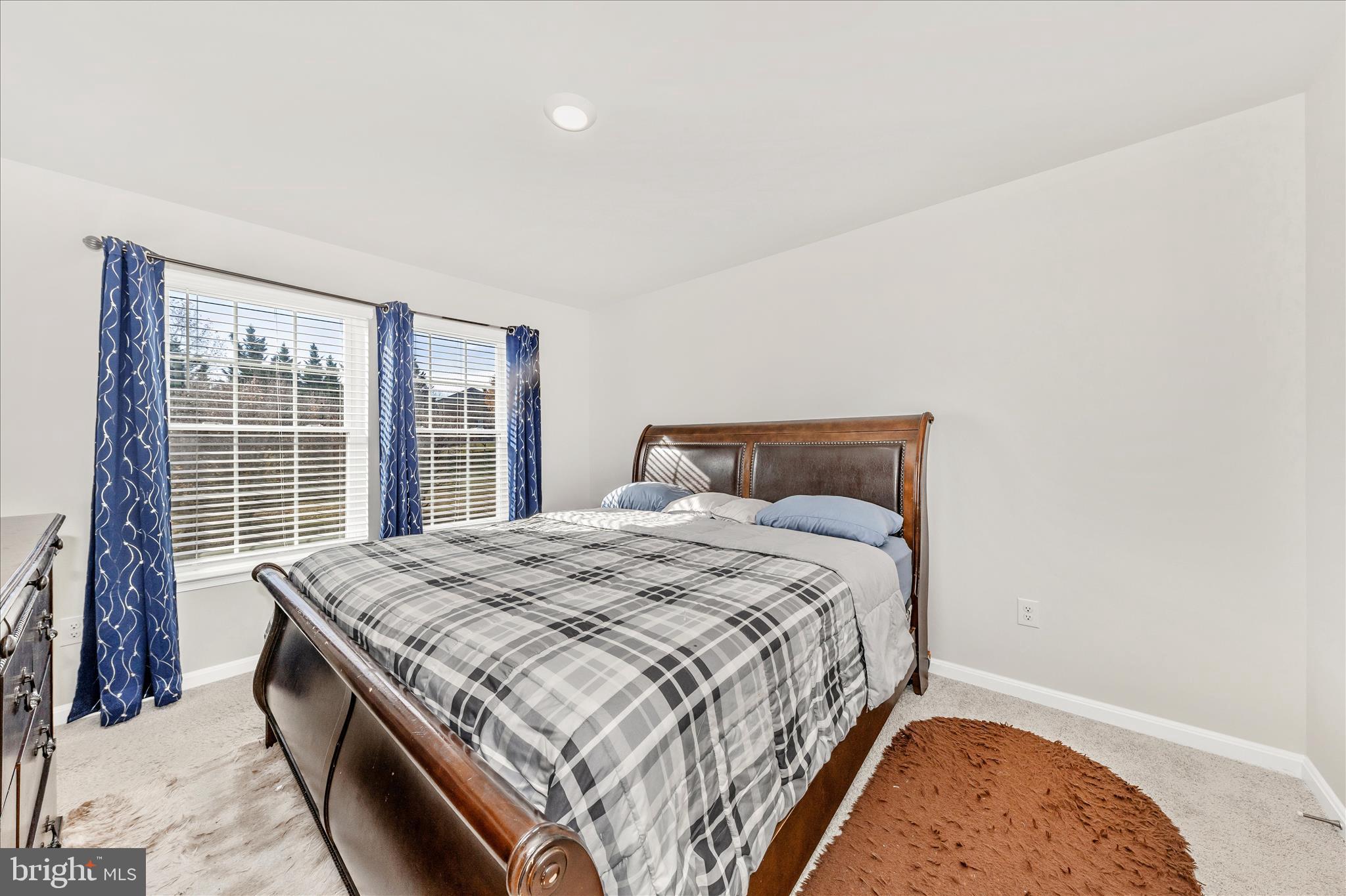 8648 Walter Martz Road Frederick, MD 21702 - Photo 23 of 50 a bedroom with a bed and a large window